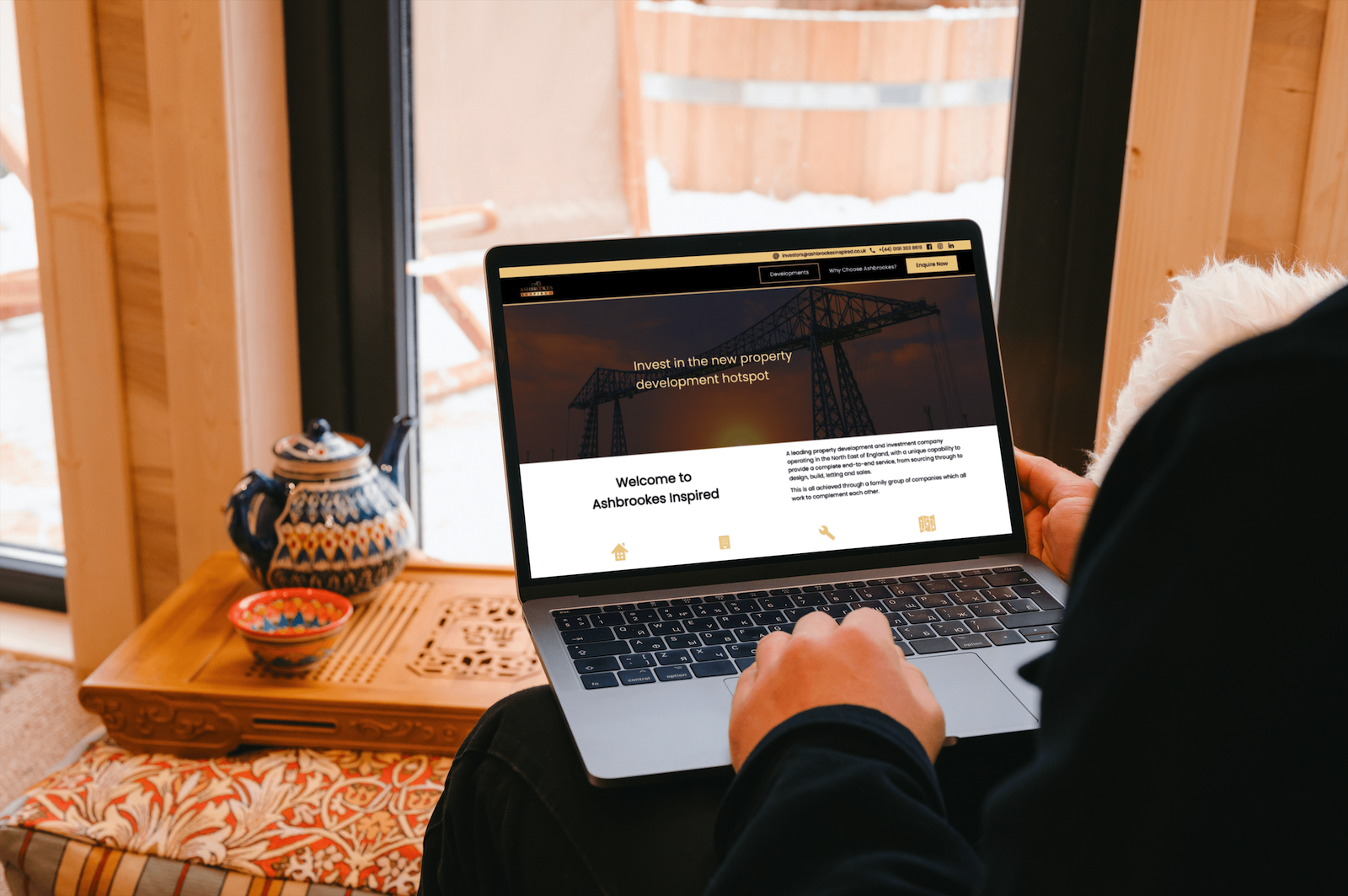 Ashbrookes website on laptop..